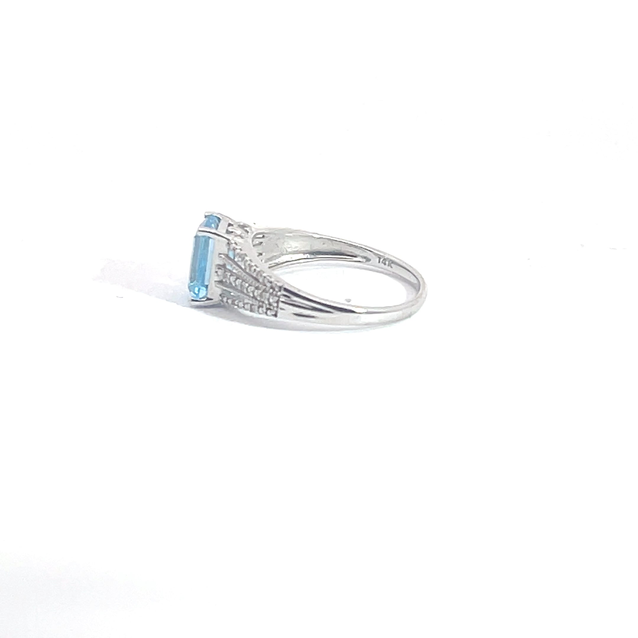 Blue Topaz and Diamond Ring set in 14K White Gold, 7