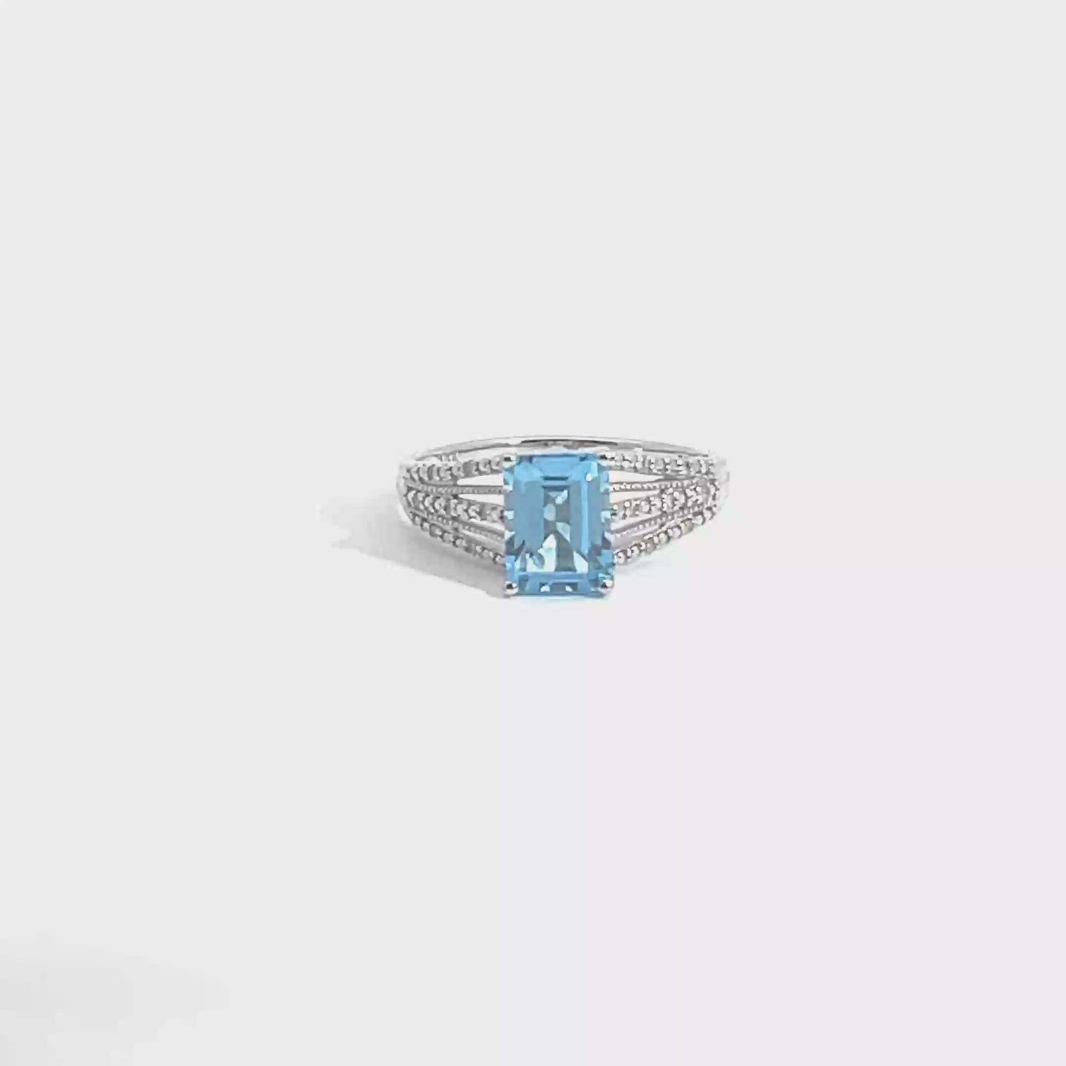 Blue Topaz and Diamond Ring set in 14K White Gold, 7